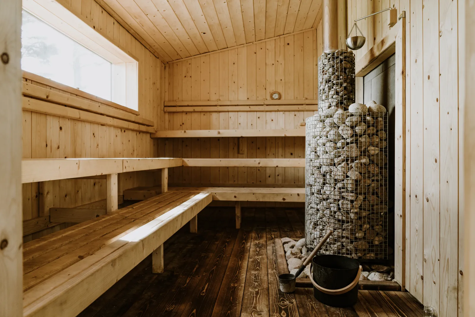 Wood-fired sauna interior at Mad Yolk Farm
