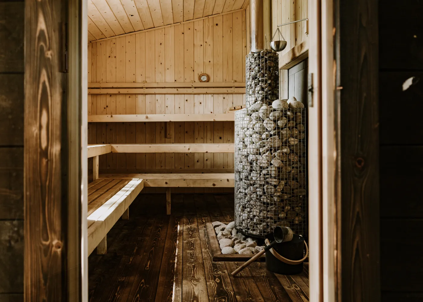 Looking through the open door into the wood-fired sauna at Mad Yolk Farm